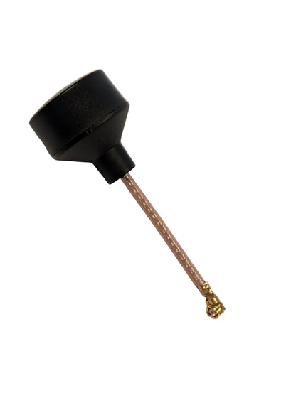Black antenna with a gold connector on a beige background