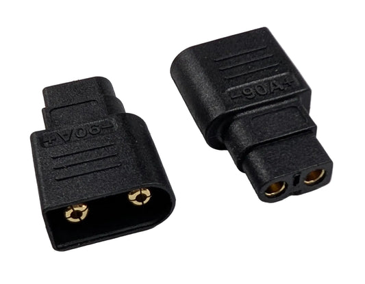 Two black electrical connectors on a gray background