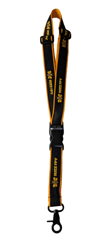 Yellow and black lanyard with a keychain on a white background