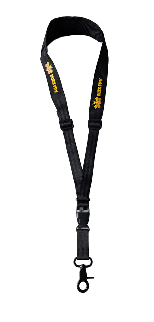 Black lanyard with yellow text on a white surface